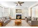 Comfortable living room with a fireplace, plush seating, a patterned rug, and hardwood floors at 10511 Sablewood Dr # 110, Raleigh, NC 27617