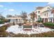 Outdoor grilling area with built-in stainless steel grills, fire pit, and picnic table at 10511 Sablewood Dr # 110, Raleigh, NC 27617
