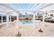 Community pool with pergola, columns, and clubhouse at 10511 Sablewood Dr # 110, Raleigh, NC 27617