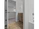 Bathroom with brown cabinets, light countertops, and a tub and shower combo at 107 Barn Door Dr, Lillington, NC 27546