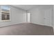 Bedroom with plush carpet, window, and neutral color palette at 107 Barn Door Dr, Lillington, NC 27546