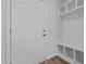 Functional entryway featuring a built-in bench with coat hooks and storage cubbies for organization at 107 Barn Door Dr, Lillington, NC 27546