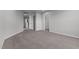 Upstairs hallway with carpet floors and access to multiple rooms at 107 Barn Door Dr, Lillington, NC 27546