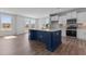 Bright, spacious kitchen with a center island, stainless steel appliances, and an open layout at 107 Barn Door Dr, Lillington, NC 27546