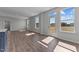 Open-concept living area featuring hardwood floors, ample natural light, and easy access to the backyard at 107 Barn Door Dr, Lillington, NC 27546