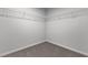 Empty walk-in closet with white wire rack shelving and carpet floors at 107 Barn Door Dr, Lillington, NC 27546