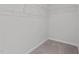 Walk-in closet with white wire rack shelving and carpet floors at 107 Barn Door Dr, Lillington, NC 27546