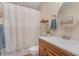 Clean bathroom with a shower/tub combo and wood vanity at 112 Wagon Trl, Willow Springs, NC 27592