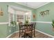 Bright breakfast nook with a bay window and seating for four at 112 Wagon Trl, Willow Springs, NC 27592