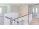 Upstairs hallway with light walls and carpeted flooring at 116 Baird Cv Ln, Angier, NC 27501