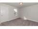 Simple bedroom with one window, neutral walls, and carpet flooring at 117 Sunburst Ct, Fuquay Varina, NC 27526