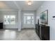 Light-filled entryway with hardwood floors, console table, and view to the living room at 117 Sunburst Ct, Fuquay Varina, NC 27526