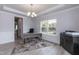 Home office features wood desk, printer stand, and large window at 117 Sunburst Ct, Fuquay Varina, NC 27526