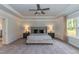 Large main bedroom with a ceiling fan and lots of natural light at 117 Sunburst Ct, Fuquay Varina, NC 27526