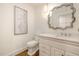Elegant bathroom with a decorative mirror, custom vanity, and marble countertop provides a luxurious touch at 12044 Iredell, Chapel Hill, NC 27517