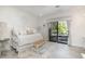 Cozy bedroom with a bench, queen size bed and natural light from the glass doors at 12044 Iredell, Chapel Hill, NC 27517