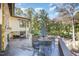 Spacious outdoor deck with a table and chairs offers an excellent view of the backyard and surrounding landscape at 12044 Iredell, Chapel Hill, NC 27517