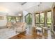 Open living space with hardwood floors, large windows, and stylish décor, perfect for entertaining at 12044 Iredell, Chapel Hill, NC 27517