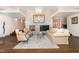 Elegant living room with a decorative fireplace, hardwood floors, and sophisticated furnishings at 12044 Iredell, Chapel Hill, NC 27517