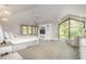 Serene main bedroom featuring high ceilings, large windows, and a cozy sitting area at 12044 Iredell, Chapel Hill, NC 27517