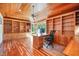 Spacious home office with custom built-ins, a wood ceiling, and ample natural light at 12044 Iredell, Chapel Hill, NC 27517