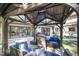 Covered patio with outdoor seating and a view of the home's exterior and backyard at 12044 Iredell, Chapel Hill, NC 27517