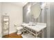 Tastefully designed powder room with a decorative sink, stylish mirror, and elegant lighting at 12044 Iredell, Chapel Hill, NC 27517