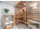 Indoor sauna with glass door, wooden benches, and shelving offering a relaxing, spa-like experience at home at 12044 Iredell, Chapel Hill, NC 27517