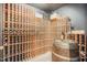Custom wine cellar featuring a wooden wine rack and a wooden barrel at 12044 Iredell, Chapel Hill, NC 27517