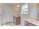 Double sink bathroom with modern vanity and a window at 121 Barn Door Dr, Lillington, NC 27546