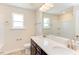 Bathroom with double vanity and a large mirror at 121 Barn Door Dr, Lillington, NC 27546