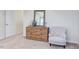 Bedroom with dresser, chair, and mirror at 121 Barn Door Dr, Lillington, NC 27546