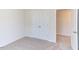 Bedroom with double door closet and carpet flooring at 121 Barn Door Dr, Lillington, NC 27546