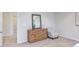 Bedroom with dresser, chair, and mirror at 121 Barn Door Dr, Lillington, NC 27546