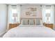 Spacious primary bedroom with large bed, nightstands, and natural light at 121 Barn Door Dr, Lillington, NC 27546