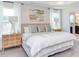 Bright bedroom with king-size bed and en-suite bathroom access at 121 Barn Door Dr, Lillington, NC 27546