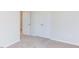 Bedroom with carpet, closet, and window at 121 Barn Door Dr, Lillington, NC 27546