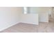 Spacious carpeted bedroom with neutral walls and hallway access at 121 Barn Door Dr, Lillington, NC 27546