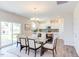 Bright dining area with glass table and access to backyard at 121 Barn Door Dr, Lillington, NC 27546