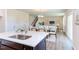 Modern kitchen island with white quartz countertops and stainless steel sink at 121 Barn Door Dr, Lillington, NC 27546