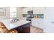 Modern kitchen with white cabinets, green tile backsplash, and stainless steel appliances at 121 Barn Door Dr, Lillington, NC 27546