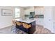Modern kitchen with white cabinets, stainless steel appliances, and an island at 121 Barn Door Dr, Lillington, NC 27546