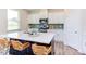 Modern kitchen with white cabinets, stainless steel appliances, and an island at 121 Barn Door Dr, Lillington, NC 27546