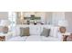 Living room with comfortable sofa and view into dining area at 121 Barn Door Dr, Lillington, NC 27546