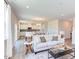 Open concept living room with a view into the kitchen area at 121 Barn Door Dr, Lillington, NC 27546