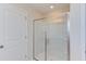 Large walk-in shower with glass enclosure and built-in shelves at 121 Barn Door Dr, Lillington, NC 27546