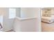 Upstairs hallway with view of bedroom and staircase at 121 Barn Door Dr, Lillington, NC 27546