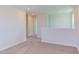 Upstairs hallway with carpeted floor and doors to bedrooms at 121 Barn Door Dr, Lillington, NC 27546