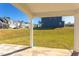 Spacious backyard with grassy area and view of neighboring homes at 128 Baird Cv Ln, Angier, NC 27501