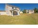 House with backyard, patio, and grassy area at 128 Baird Cv Ln, Angier, NC 27501